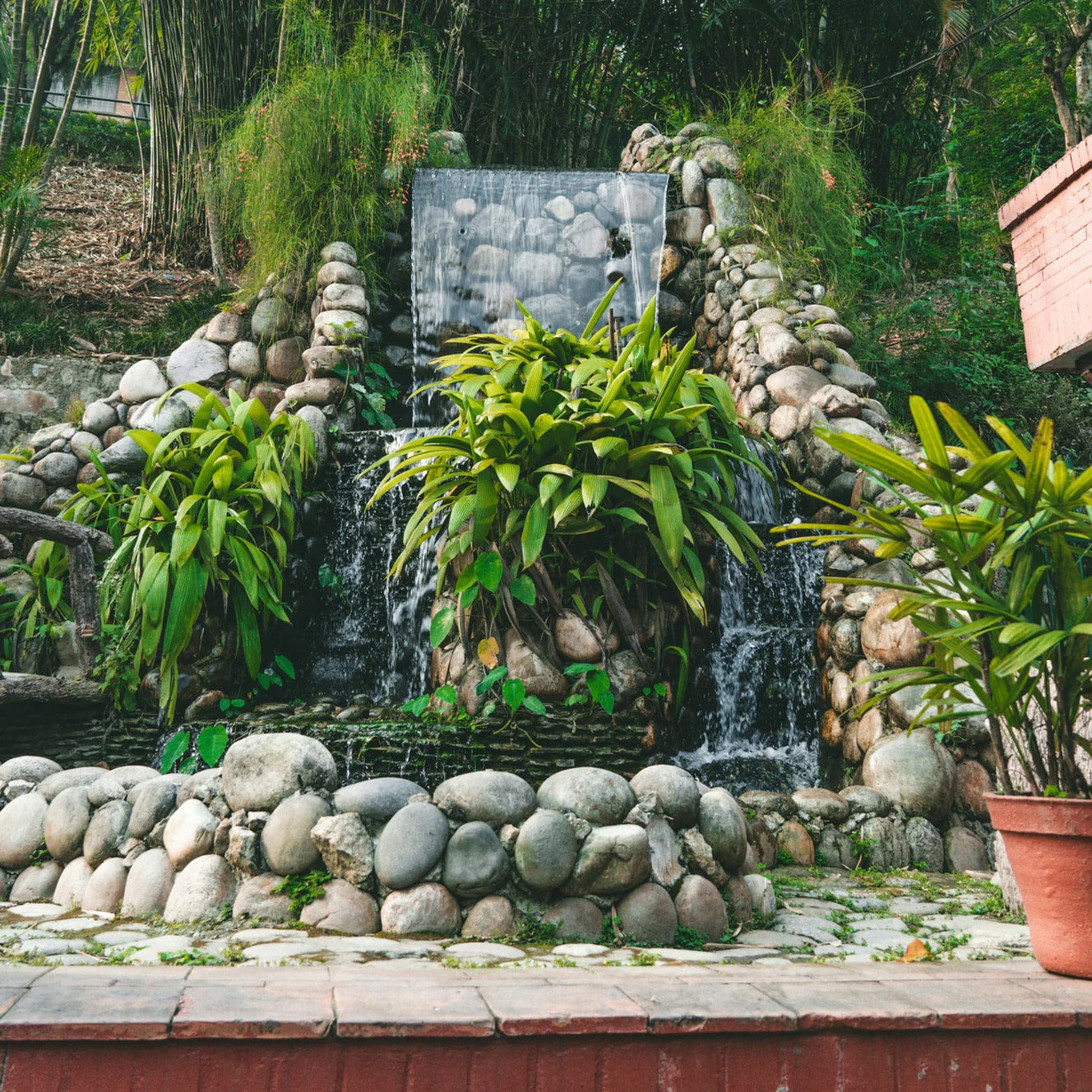 Create an outdoor relaxation area with stones and fountains